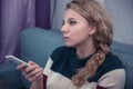 Young girl with pigtails is watching TV