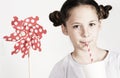 Young girl with a pin wheel and fresh drink Royalty Free Stock Photo