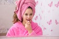Young girl use lipstick for his face in the bathroom Royalty Free Stock Photo