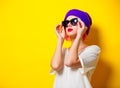 Girl with pink hair in purple hat and sunglasses Royalty Free Stock Photo