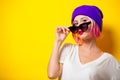 Girl with pink hair in purple hat and sunglasses Royalty Free Stock Photo