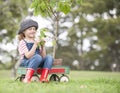 Young girl planting tree in park eco-aware Royalty Free Stock Photo