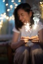 Young girl play a sparkle stick firework Royalty Free Stock Photo