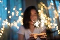 Young girl play a sparkle stick firework Royalty Free Stock Photo