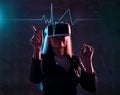 Young girl play virtual reality game wear vr glasses and explore alternative reality. woman in cyber space and virtual gaming