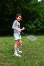 Girl playing badminton in the park. Royalty Free Stock Photo