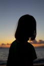 A young girl playing on a beach in Maui