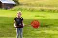 Young girl playing with a butterfly net on the meadow Royalty Free Stock Photo