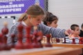 Young girl playing chess