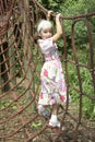 Young girl playing on climbing frame 02