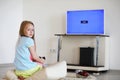 Young girl playing in front of the TV Royalty Free Stock Photo