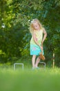 Young girl playing croquet Royalty Free Stock Photo