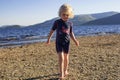 A young girl playing on the beach on a summers day Royalty Free Stock Photo