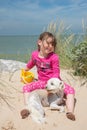 Pretty little girl making sandcastles on the beaches Royalty Free Stock Photo