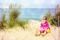 Pretty little girl making sandcastles on the beaches of Hauts-de-France Royalty Free Stock Photo