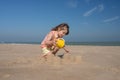 Pretty little girl making sandcastles on the beaches of Hauts-de-France Royalty Free Stock Photo