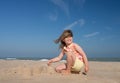 Pretty little girl making sandcastles on the beaches of Hauts-de-France Royalty Free Stock Photo