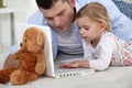 Young girl playing with laptop