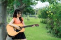 Young girl playing music with guitar relax Royalty Free Stock Photo