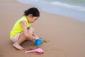 A young girl playing sand at the beach Royalty Free Stock Photo