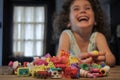 Young girl holding Shopkins a range of tiny collectable toys manufactured by Moose Toys