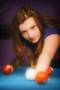 Young girl playing snooker