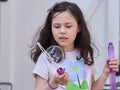 young girl playing with soap bubbles Royalty Free Stock Photo
