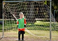 Young girl playing soccer in goal Royalty Free Stock Photo