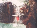 Young Girl playing and splashing in a waterfall Royalty Free Stock Photo