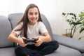 young girl playing video games on white. High quality photo Royalty Free Stock Photo