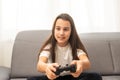 young girl playing video games on white. High quality photo Royalty Free Stock Photo