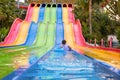 A young girl playing on a waterslide at waterpark  in Asia Royalty Free Stock Photo