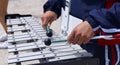 Young girl plays lyre in a march band