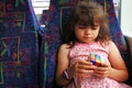 Young girl plays with Rubik`s Cube Royalty Free Stock Photo