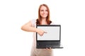 Young girl pointing to a blank laptop screen Royalty Free Stock Photo