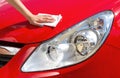 Young girl polishing car