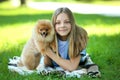 Girl with pomeranian dog