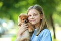 Girl with pomeranian dog