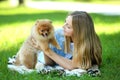 Girl with pomeranian dog