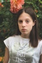 Young girl in the rose garden