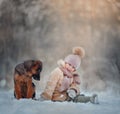 Young girl portrait with puppy under snow Royalty Free Stock Photo