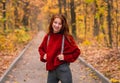 Young girl posing on autumn park road Royalty Free Stock Photo