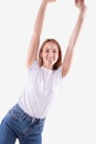 Young girl posing with happy smile and rising arms up. Freedom, enjoing concept