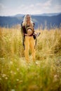 A young girl is posing for a photo while walking in the nature. Hiking, nature, activity