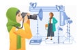 Young girl pothographer taking a picture of fashionable hijab girl in profesional studio vector illustration