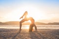 Young Girl Practicing Yoga On Beach At Sunset, Beautiful Woman Summer Vacation Meditation Seaside Royalty Free Stock Photo