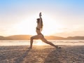 Young Girl Practicing Yoga On Beach At Sunset, Beautiful Woman Summer Vacation Meditation Seaside Royalty Free Stock Photo