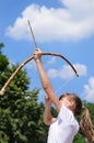 Young girl practising archery