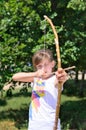 Young girl practising with a bow and arrow