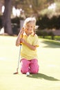 Young Girl Practising Golf Royalty Free Stock Photo